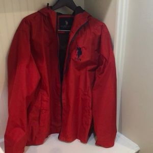 NWOT U.S POLO ASSN. Rich red raincoat with hood.